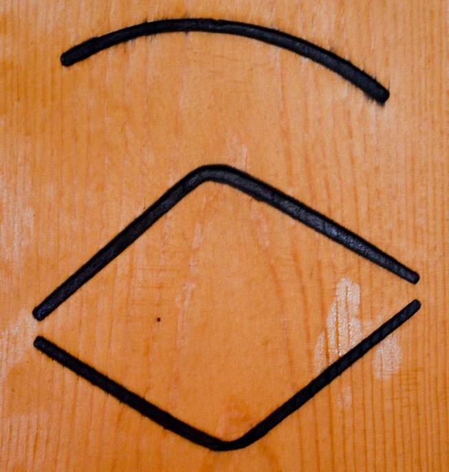 This cattle brand, shown at the Lyon County Museum, belongs to the Holy Family Catholic Church in Yerington, Wednesday, Oct. 23, 2013. In 1951, the church decided to raise cattle to raise money for needed projects. The church did so for about a decade. The brand is known as the "Eye of God," the triangle is the eye, with an eyebrow above. It's the only known Catholic Church brand in the state from the time.